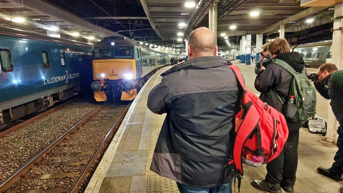 Photographers snapping Class 57 Restormel Castle along side the Caledonian Sleeper. This was just before the trains departed at 23.30 and 23.33pm