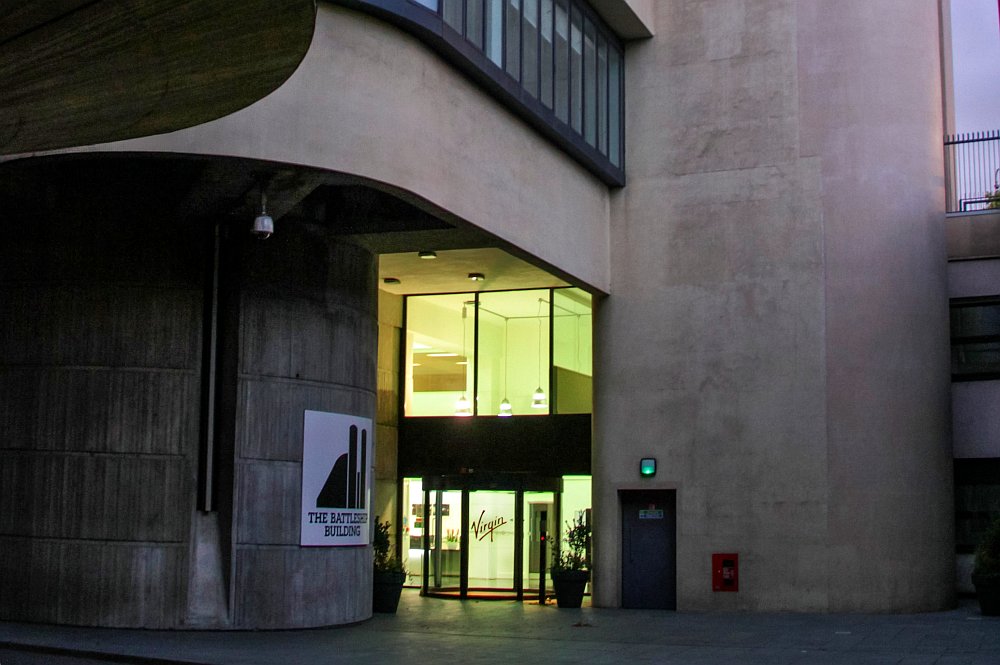 The main entrance to the Battleship building at a time when Virgin resided at the premises. Its logo can be seen on the main door. To the left of this can be seen the older Battleship building logo.