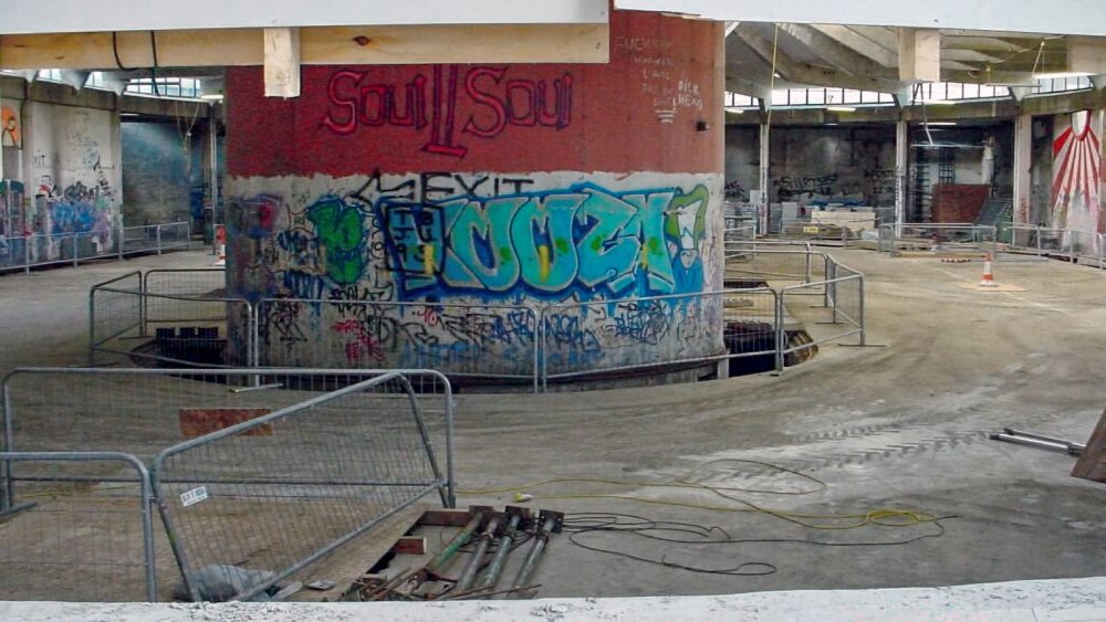 The interior of the Rotunda during building works in 2001. This used to be partitioned by various departments each with a different role in the maintenance and repair of vehicles. Some fencing surrounds the central pillar and it seems infilling of the trenches (which once drained away any water) is underway.