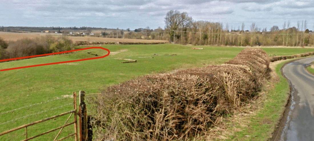 View of part of the former tramway near Blisworth village which can be seen in the distance. The local minor road between her and Stoke Bruerne is on the right.
