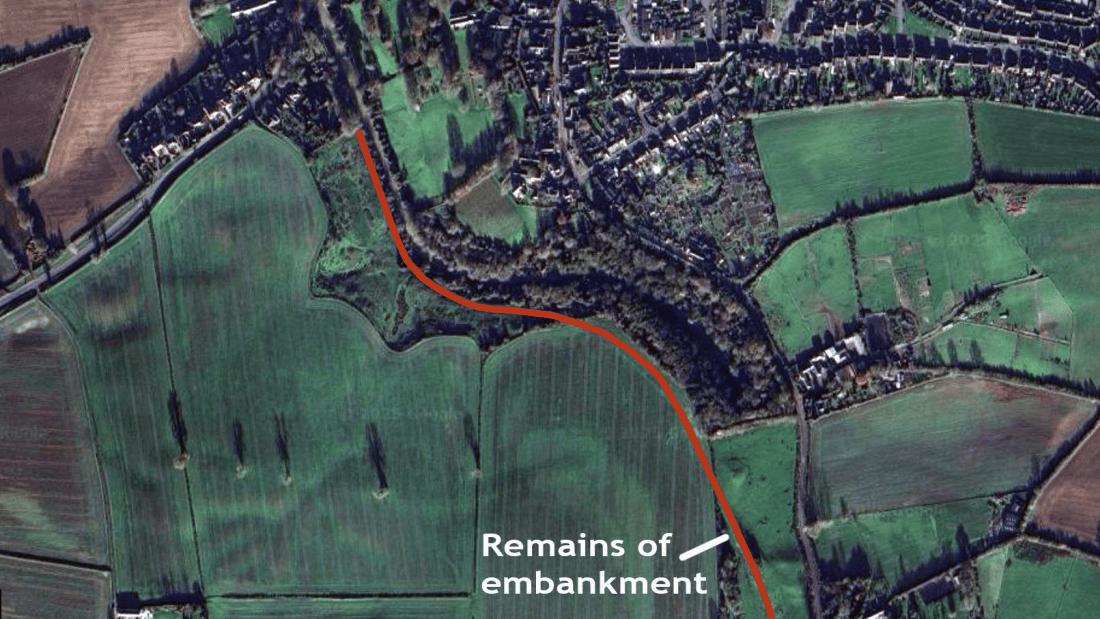 Map showing the course of the tramway (marked in red) at the Blisworth end. The map shows the fields and woods and present housing quite well and in the middle of al this is the winding course of the canal as it approaches the entrance to its tunnel.