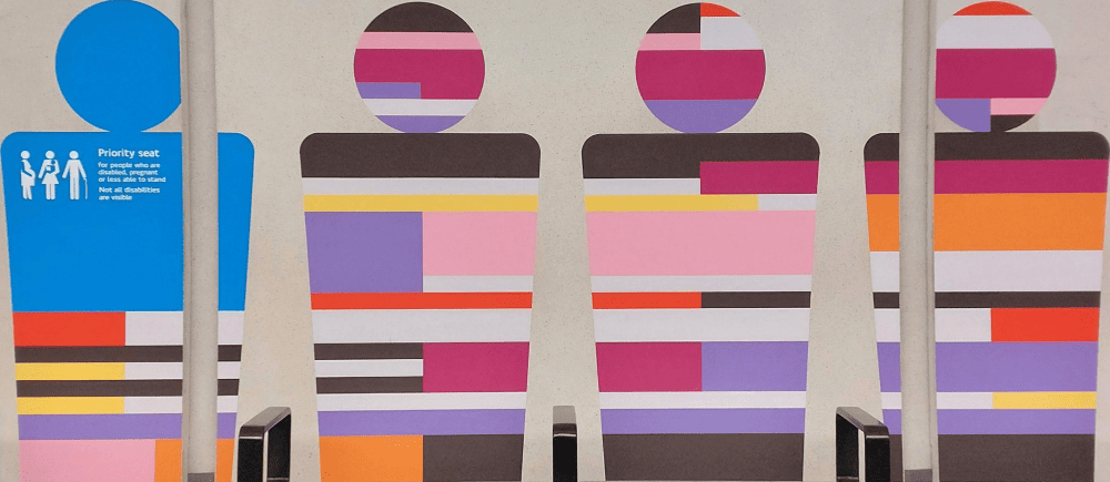 The four seat covers at each station represents the lines served by these interchange stations. They're basic variations on TfL's seat moquette designs.