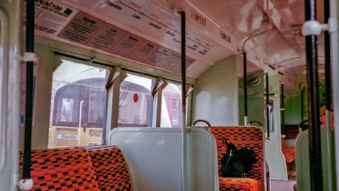 VECTIS unit en route to Shanklin passing a Class 483 unit stabled at Ryde St. Johns Road. The 483 can be seen on the left through the VECTIS unit's windows.
