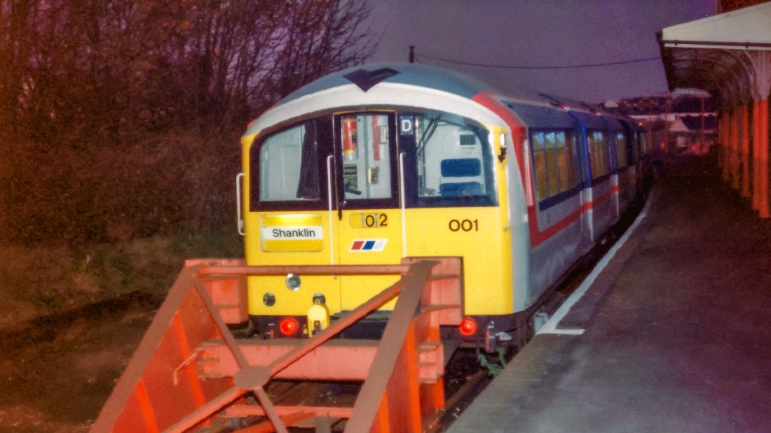 Class 483 001 at Shanklin one evening in the summer of 1989. The station buildings are at right. Almost all of the train's doors can be seen closed. Photo was taken with a flash. The bright yellow front of the train stands out quite strongly.