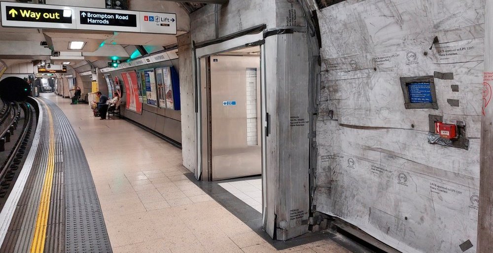 The westbound platform with its unfinished entrance area and walls. These are temporarily covered in flame retardant material pending work to render and tile the walls and pillars.