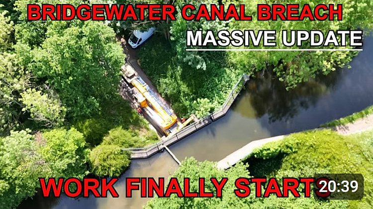 Picture shows the Woodhouse lane aqueduct with the Ainscough crane on site and the new stop planks installed at the aqueduct. The text says Bridgewater Canal Breach - Massive update: Work finally starts. The length of the video (20 minutes 39 seconds) is given.